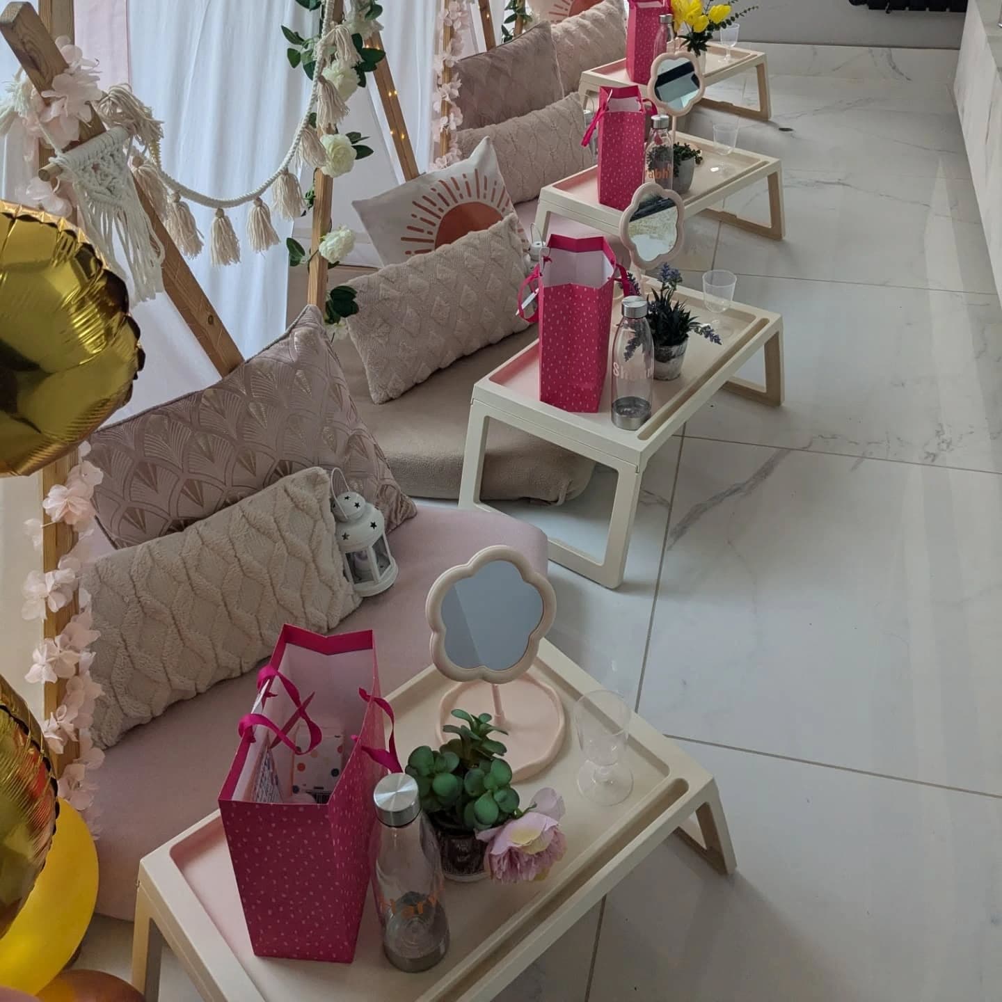Individual pamper party places with flower mirrors, trays and pink accessories