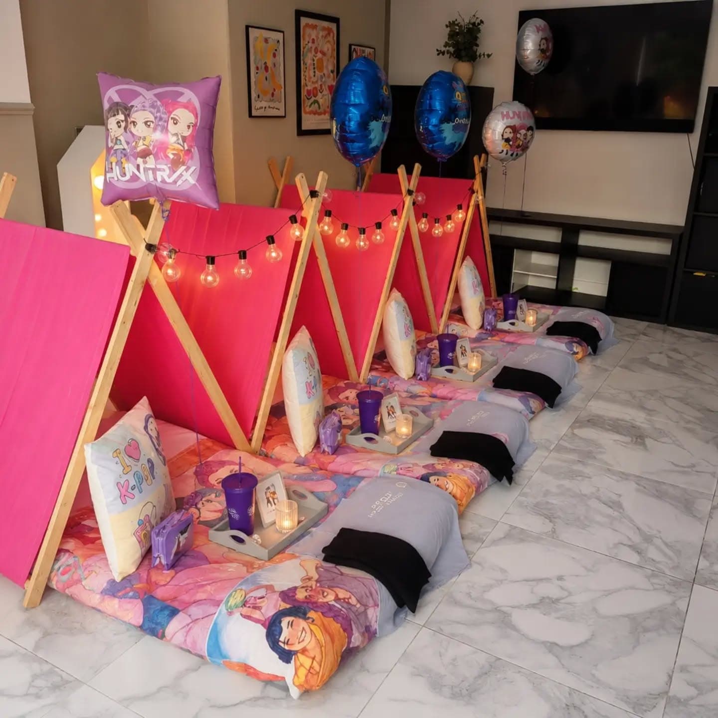 Bright pink pop star themed teepees with character bedding and lights